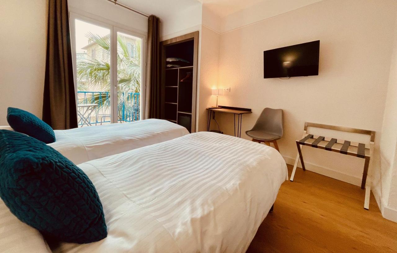 Hotel Courbet Juan-les-Pins Bagian luar foto